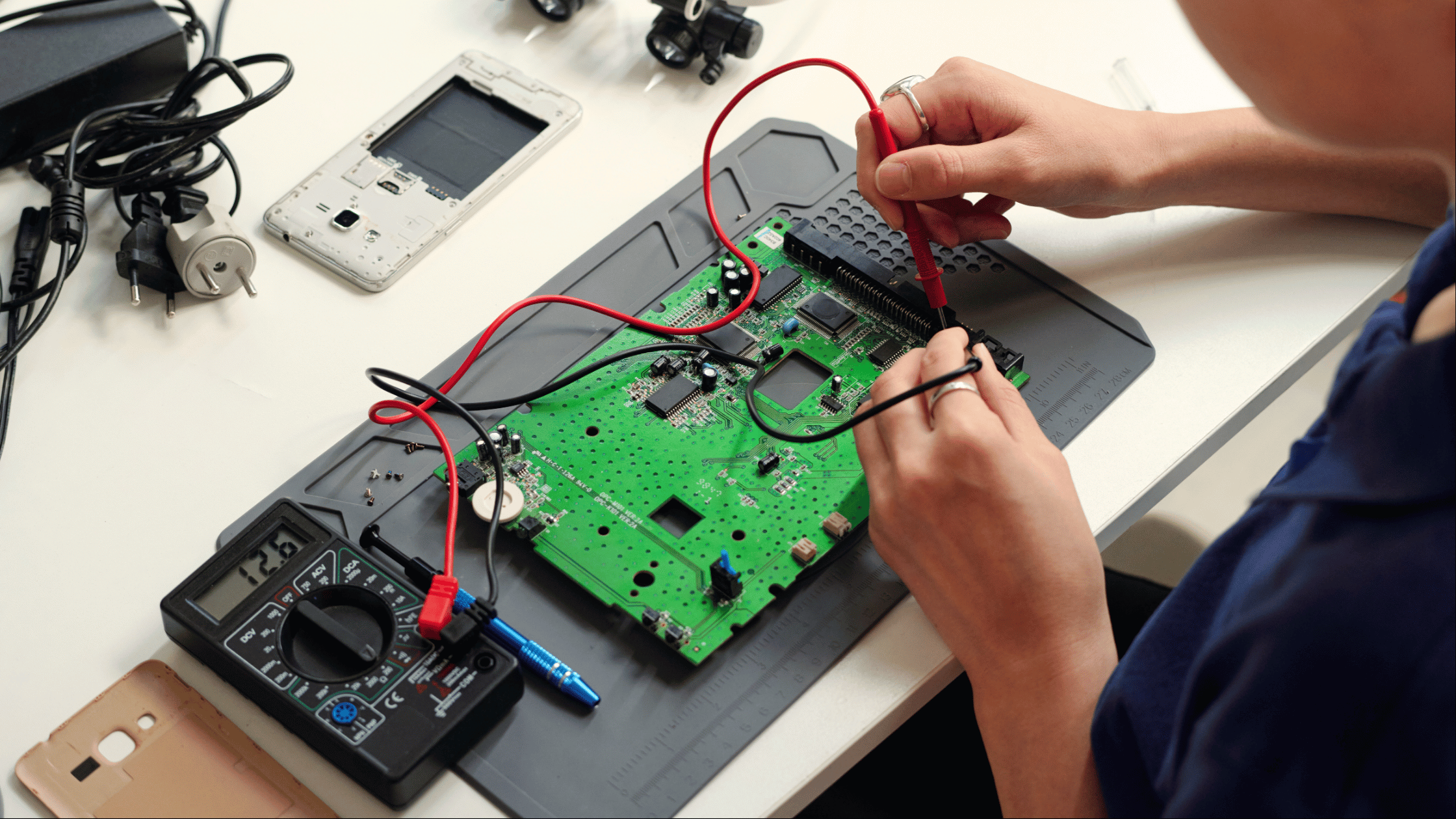 An engineer testing electronic equipment | Blog: Regulated vs Unregulated Power Supplies